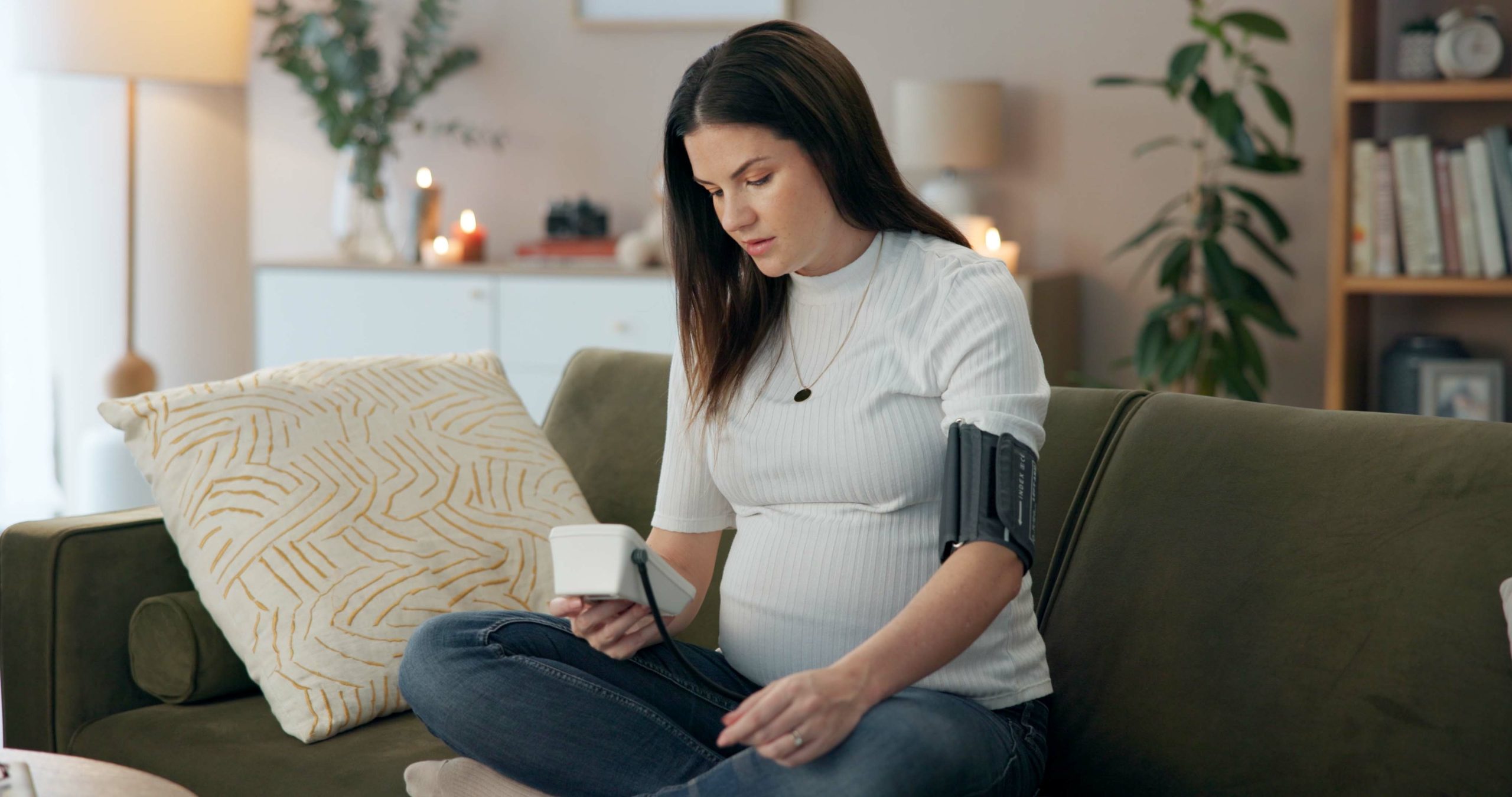 Pregnant lady taking her own blood pressure