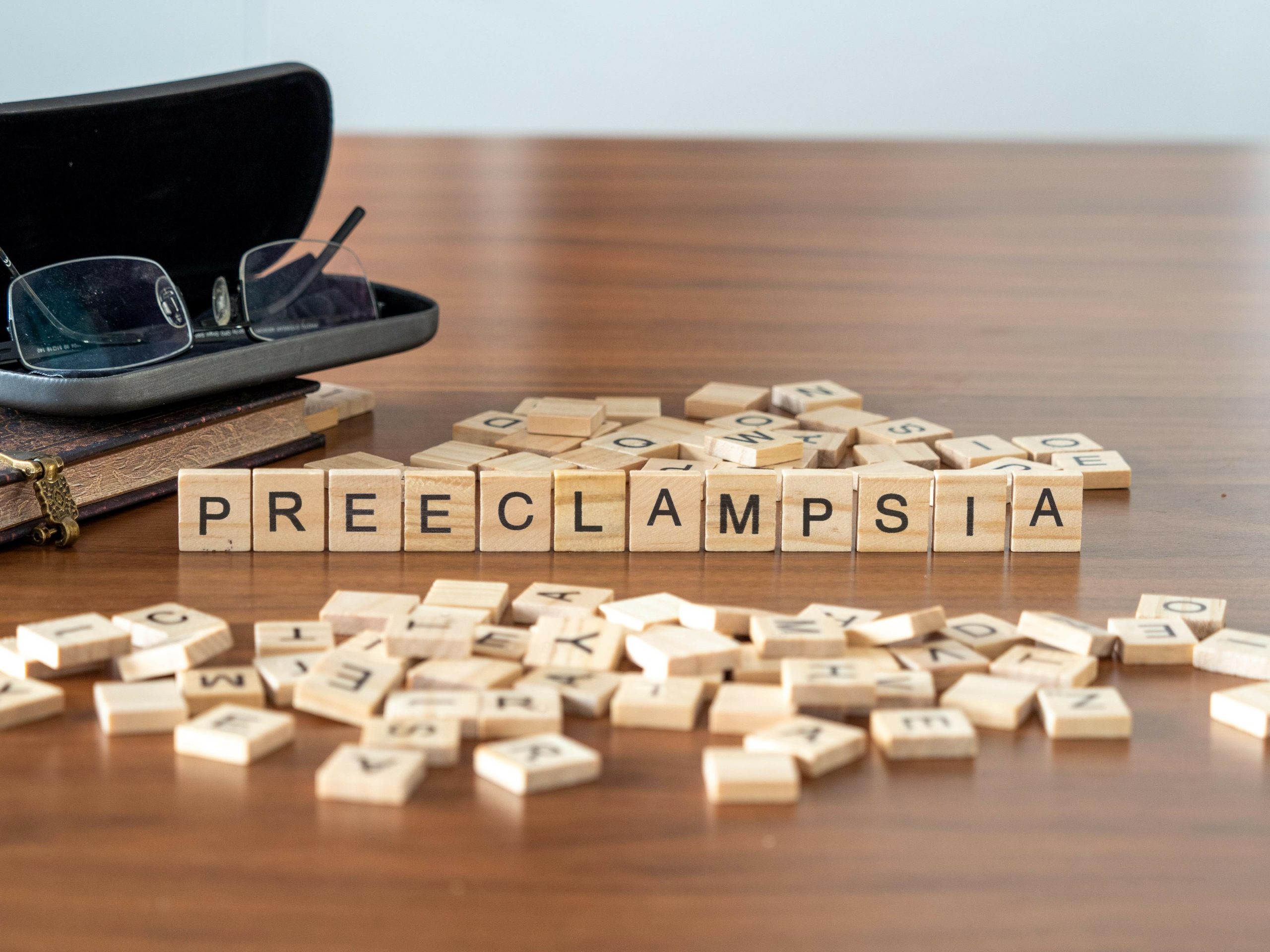 scrabble tiles spelling out the word preeclampsia