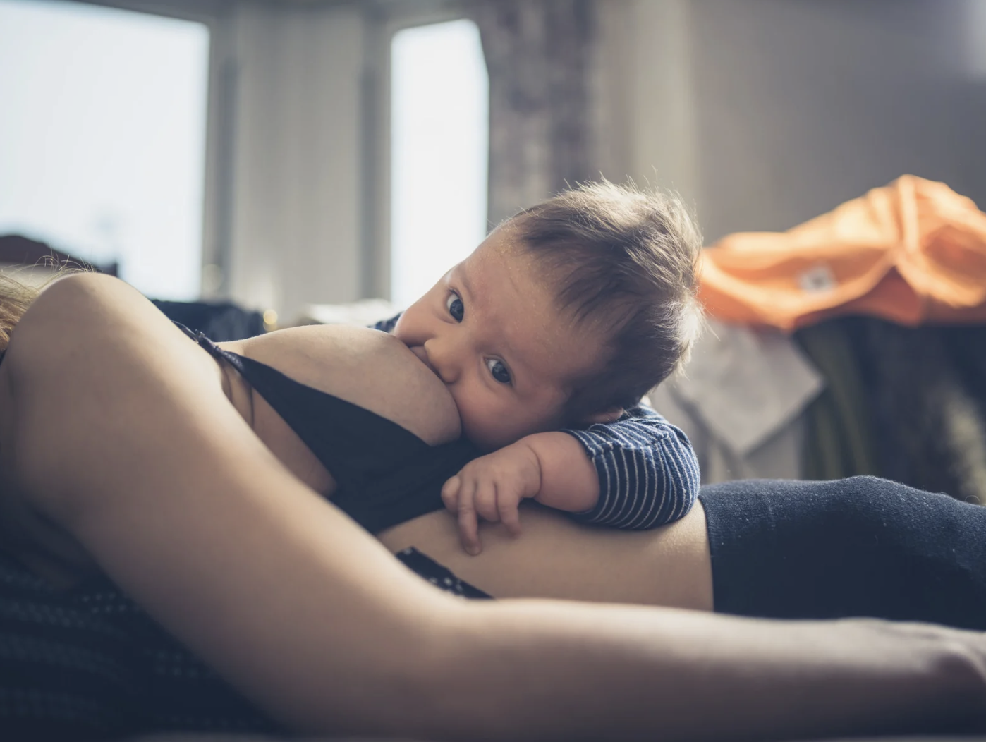 woman breastfeeding baby