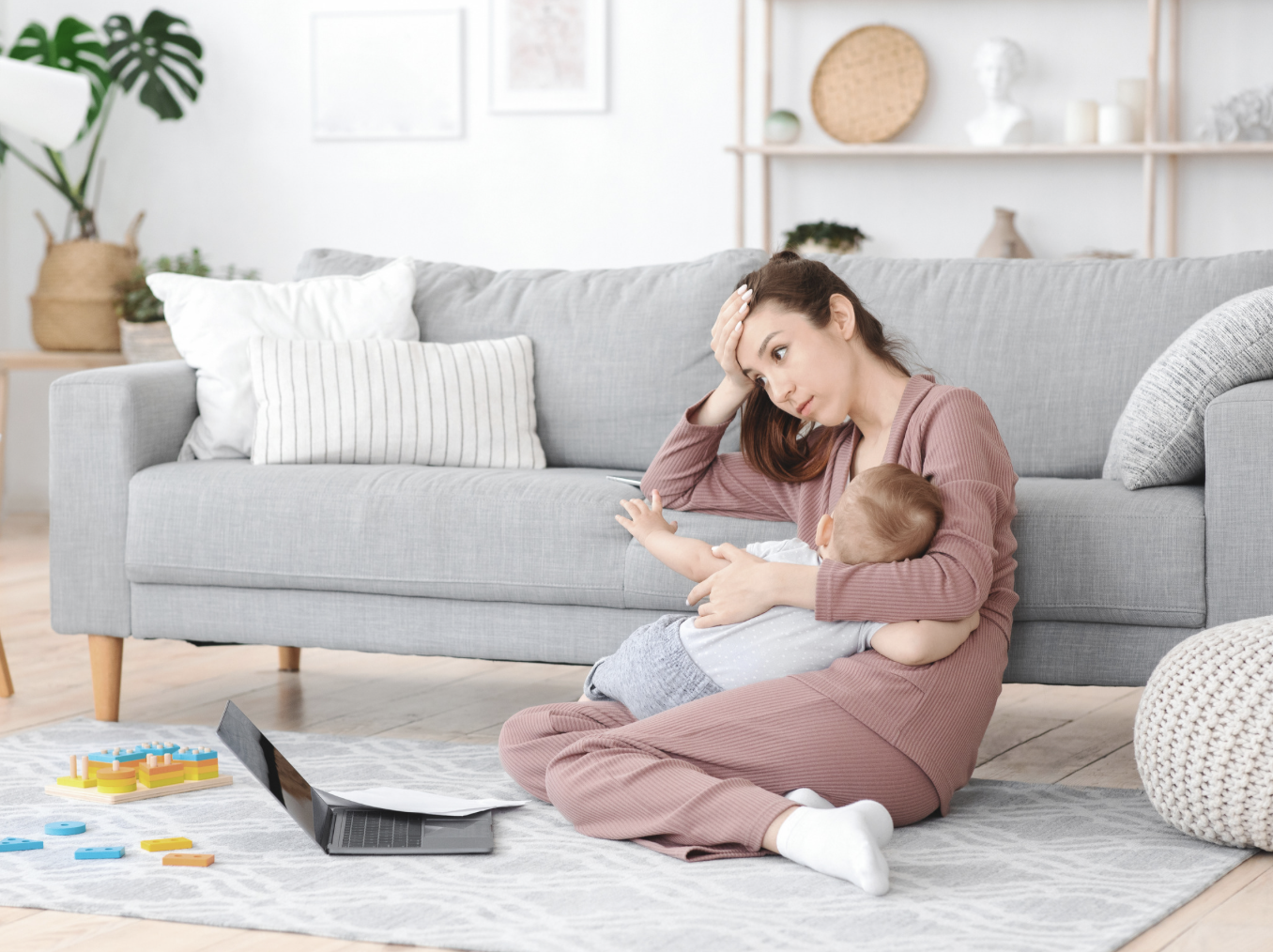 stressed mother while breastfeeding
