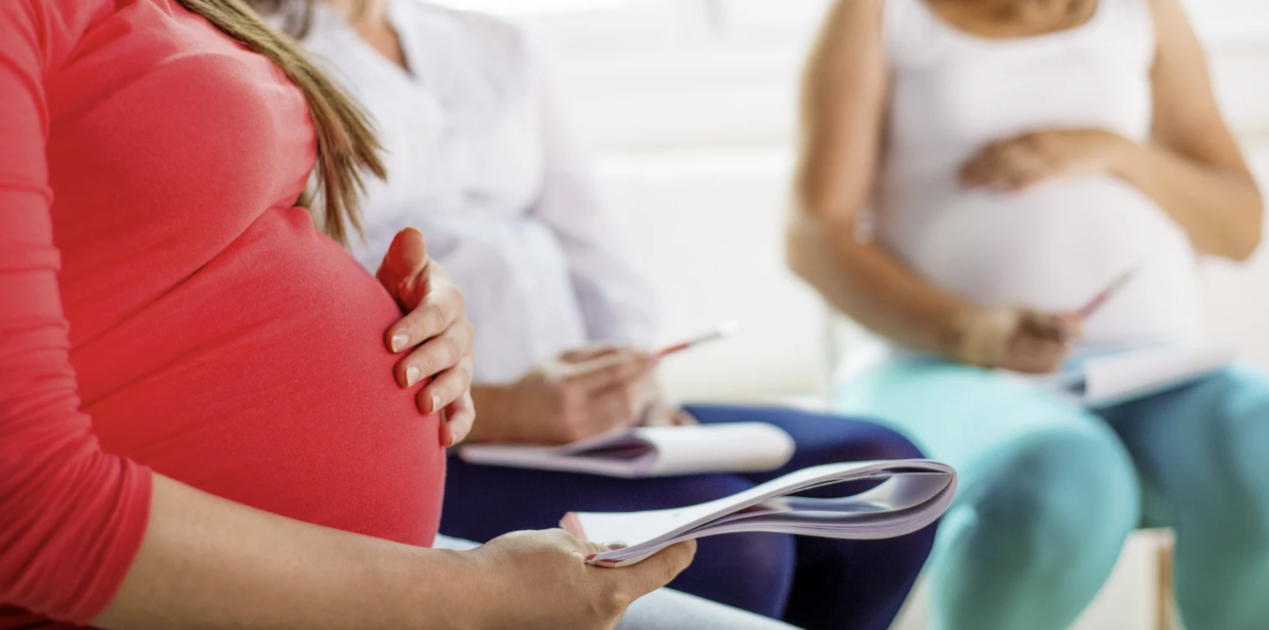 group of pregnant woman sat together