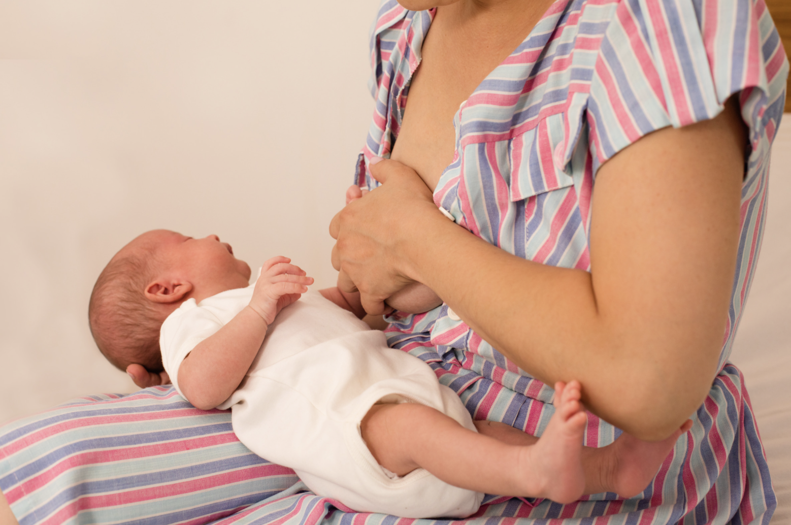 woman holding breast with hand