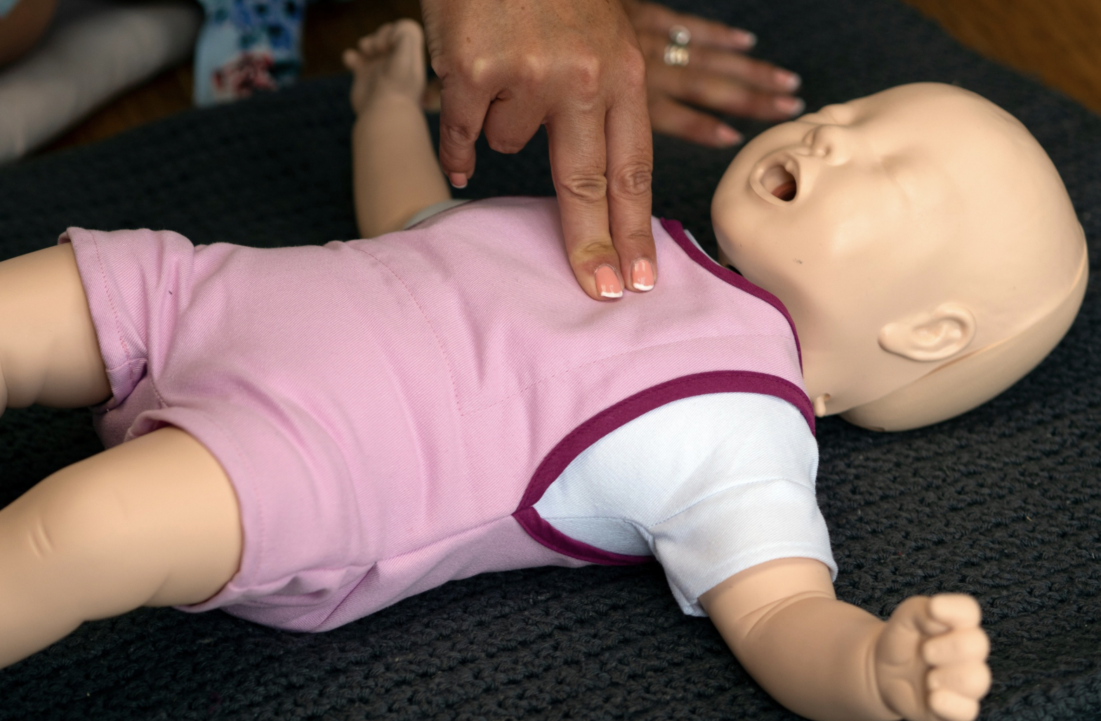 CPR on a baby doll