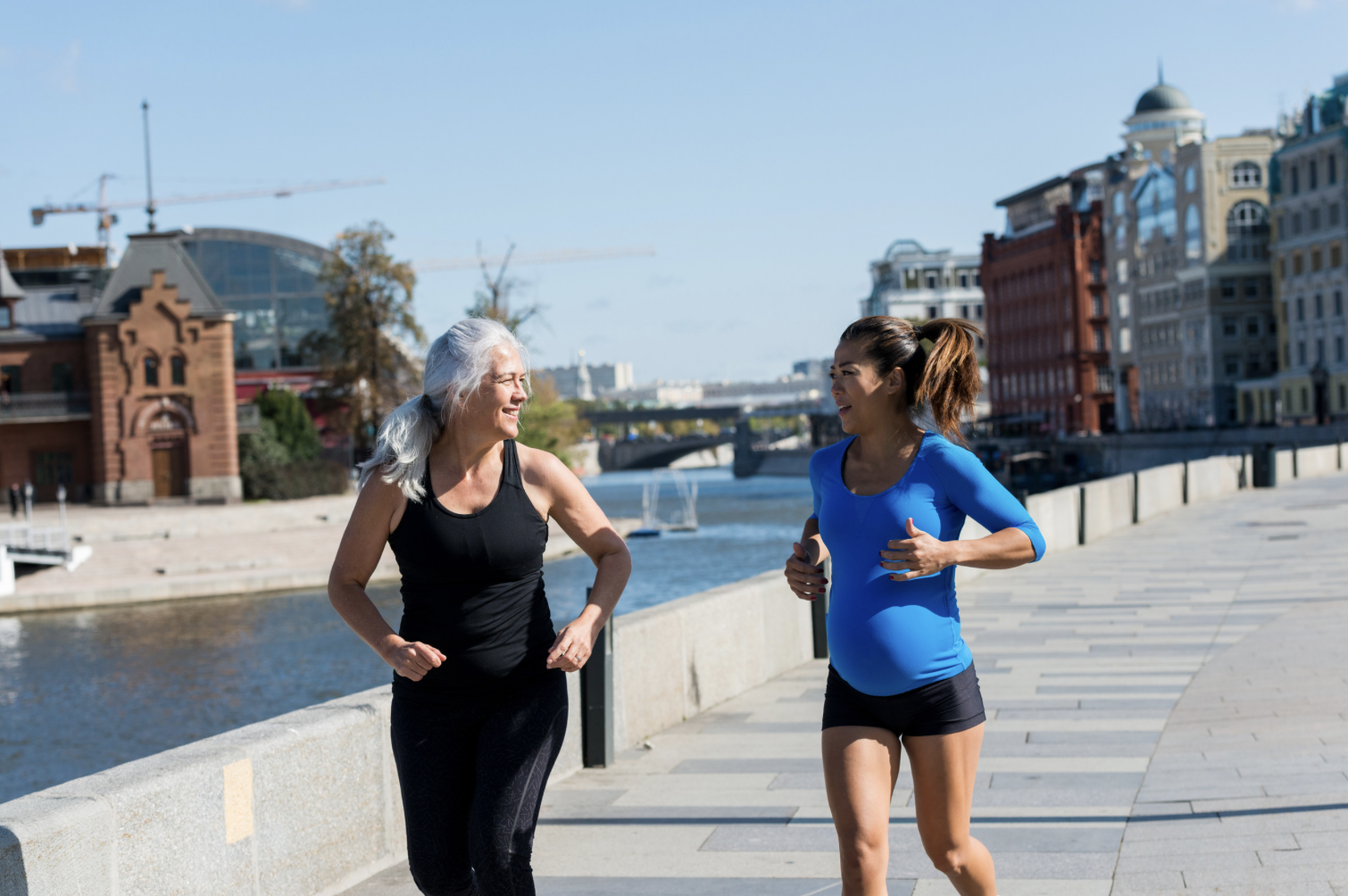 pregnant woman running with friend