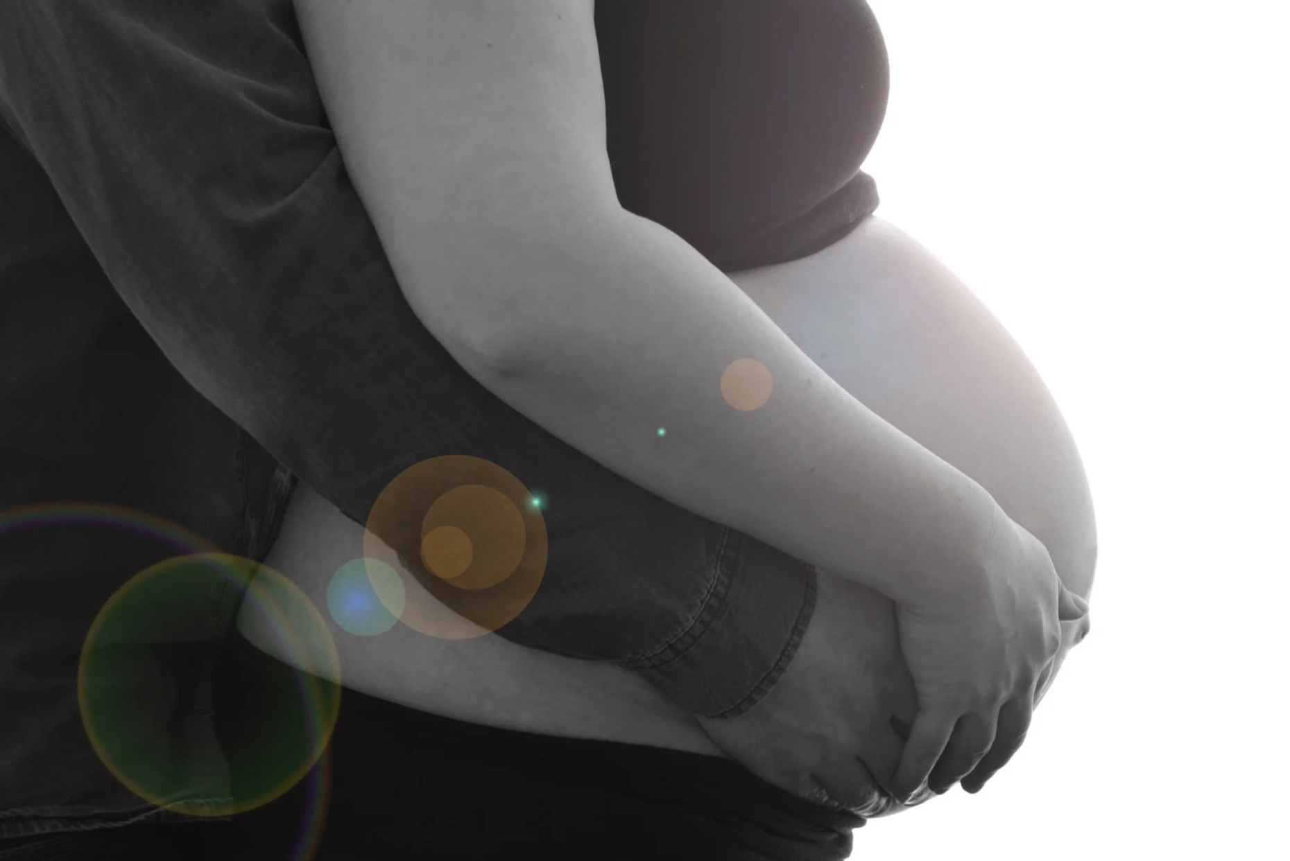 pregnant woman holding bump